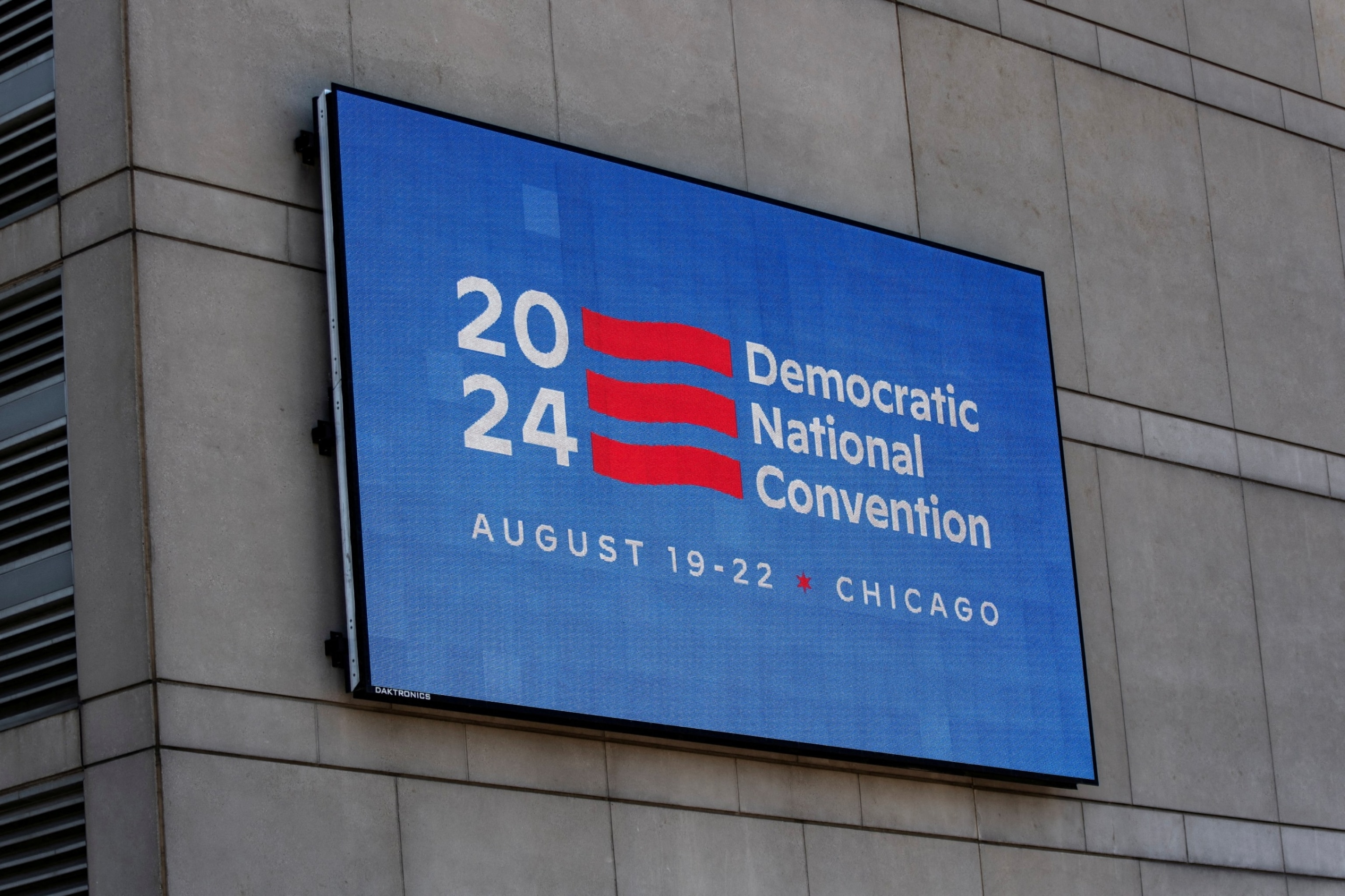 PHOTO: An LED sign located on the United Center displays a DNC 2024 logo and information outside the United Center, the venue for the upcoming Democratic National Convention (DNC), during a media walk through of the facility in Chicago, May 22, 2024. 