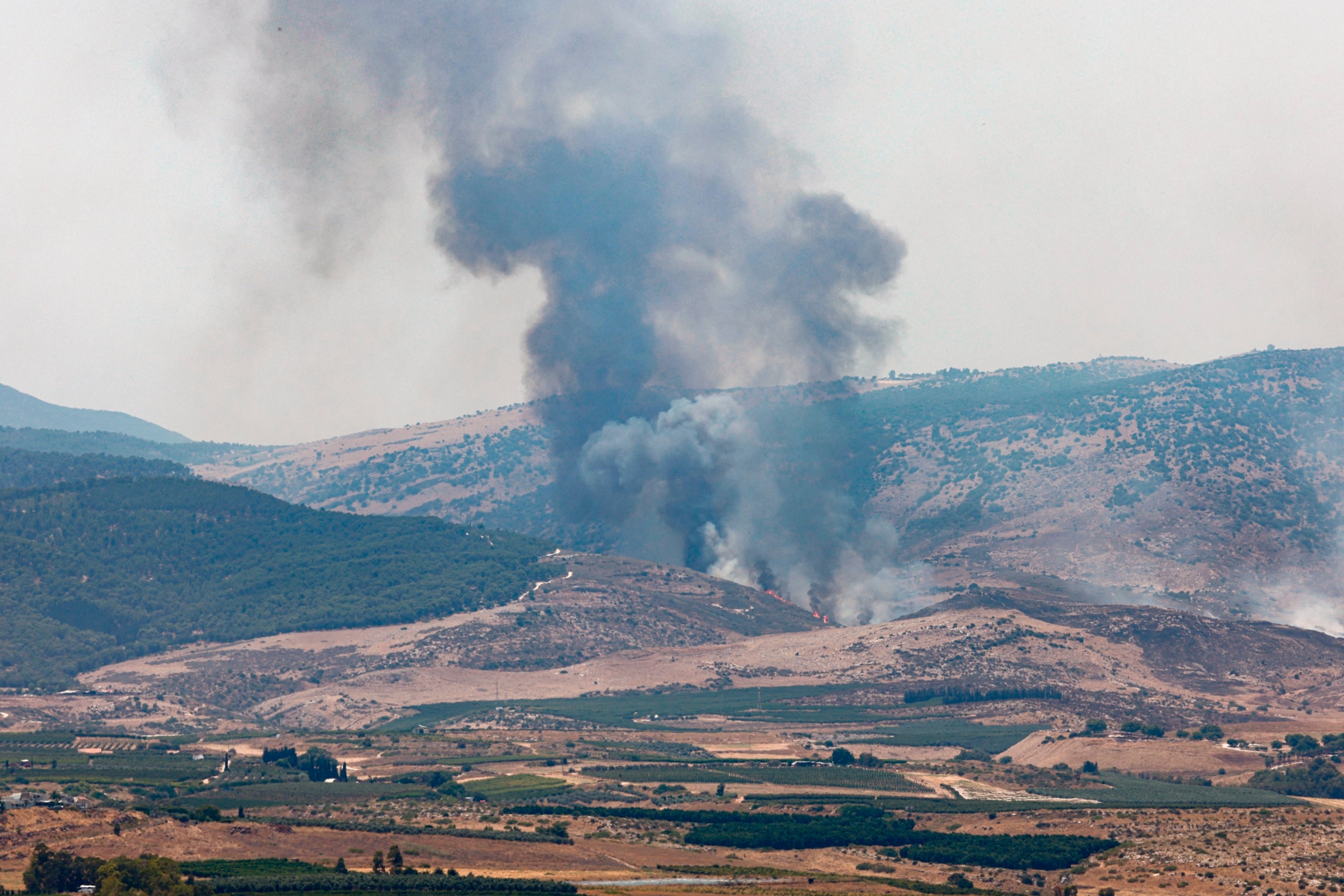 PHOTO: Fire and smoke billows after rockets launched from southern Lebanon hit areas in northern Israel on July 4, 2024. 