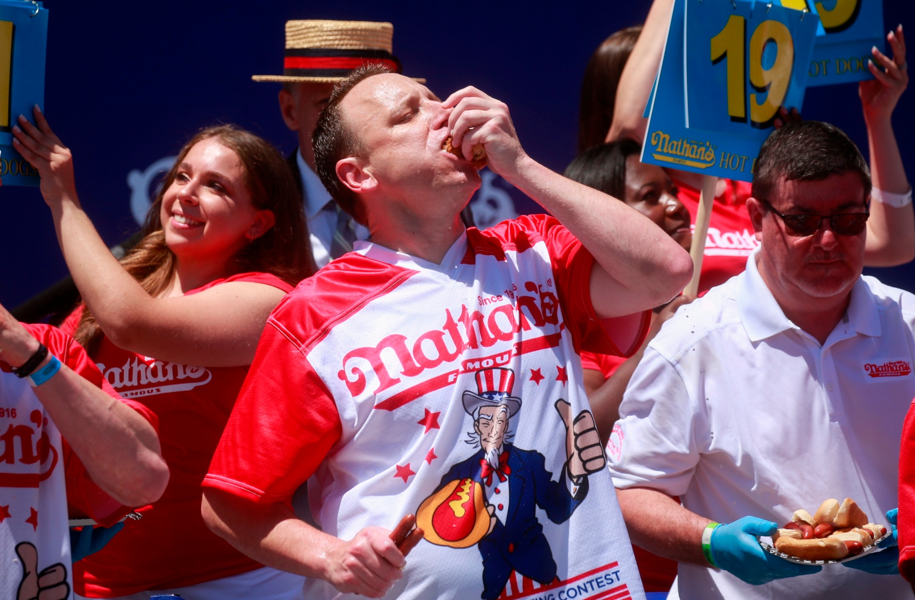 PHOTO: Joey Chestnut eats hot dogs during the 2022 Nathans Famous Fourth of July International Hot Dog Eating Contest in Coney Island, NY, July 4, 2022.