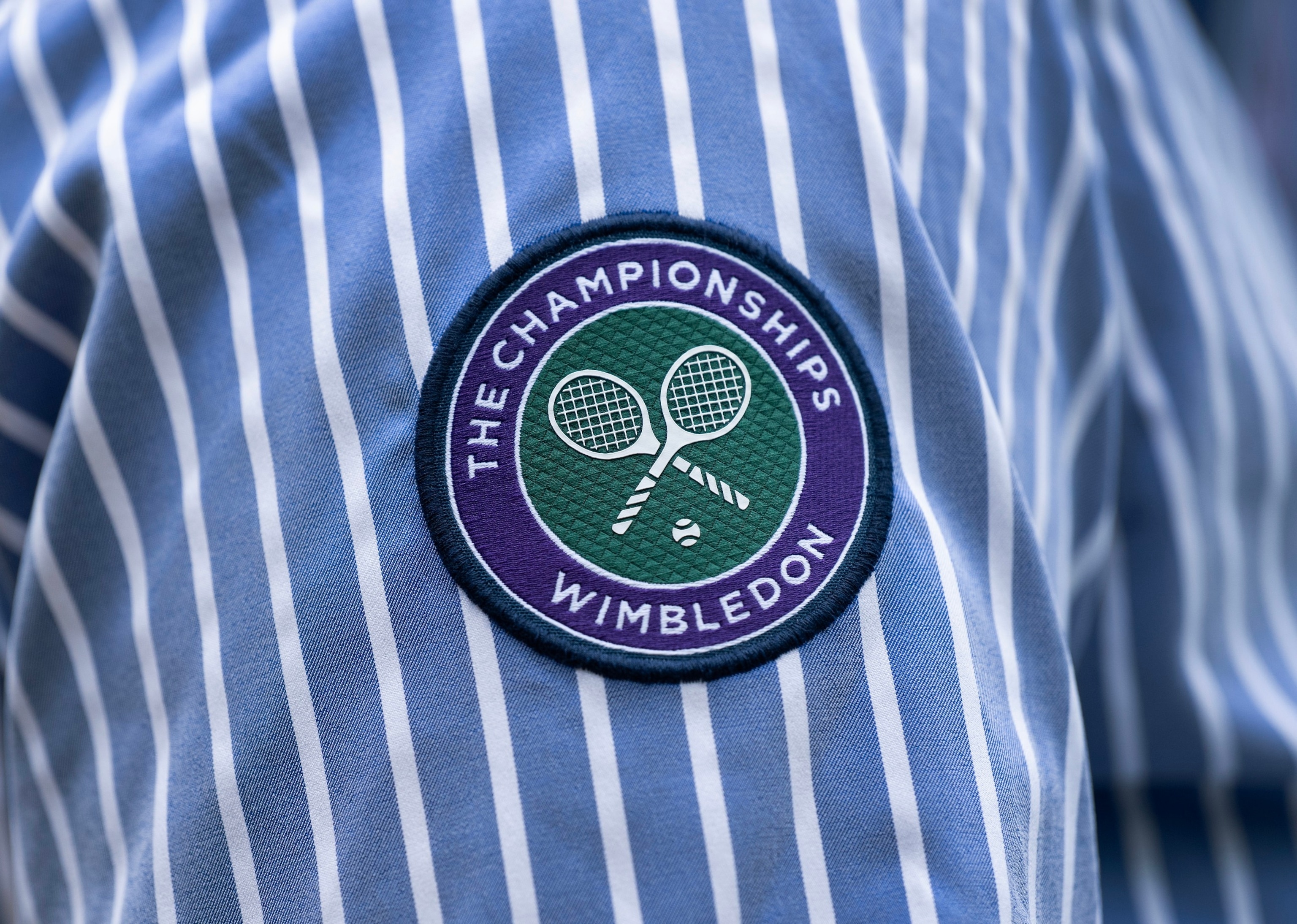 PHOTO: The AELTC logo on the arm of a line judge during day four of The Championships Wimbledon 2023 at All England Lawn Tennis and Croquet Club on July 6, 2023 in London.